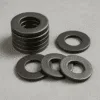 Stack of heavy duty washers used for structural fastening and high load applications, best washers manufacturer in India, heavy-duty flat washers for machinery use, heavy-duty flat washers for high-stress applications washers